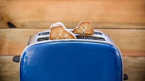 Seamless loop - Toast popping out of vintage blue toaster in slow motion, HD Video stock 91170854