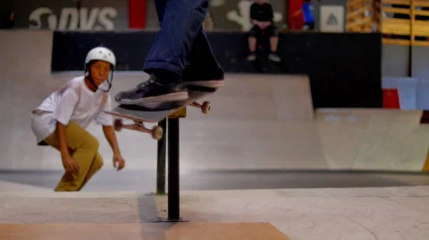 Seamless loop of two skaters -Back to Back boardslides Stock Footage 41722301