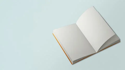 Seamless loop video. Book page flipping on light blue background. Concept Video stock 196210104