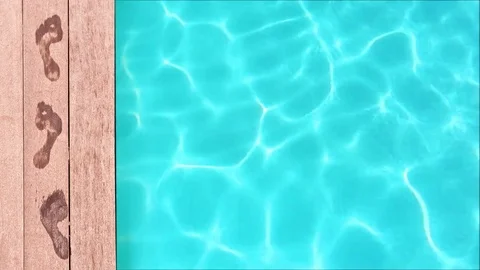 Seamless loop - Wet footprints by a swimming pool, summer concept Stock Footage 73620177