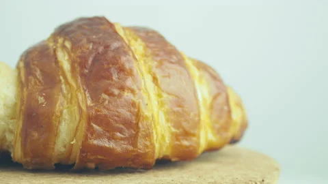 Seamless loopable 4k footage rotating of sweet fresh croissant Stock Footage 232924391