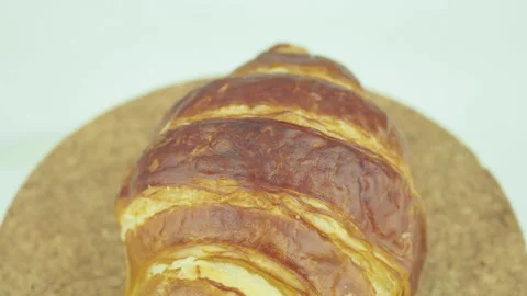 Seamless loopable 4k footage rotating of sweet fresh croissant Stock Footage 232924454