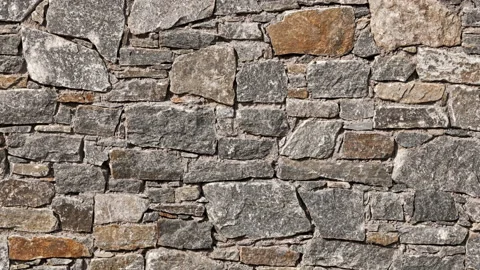 Seamless looped stone wall background Stock Footage 138440972