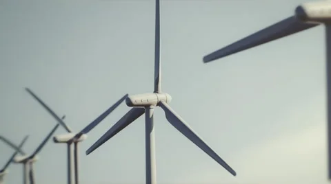 Seamless looping animation of wind turbines spinning 4k Stock Footage 64742872