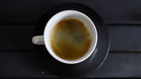 Seamless looping, Espresso coffee on a white porcelain mug Stock Footage 82146746