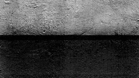 Seamless looping motion background features a dark cement wall texture and Stock Footage 160606844