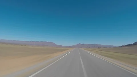 Seamless looping motion blure POV driving shot on an empty road 스톡 동영상 89717018