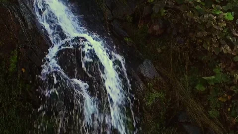 Seamless looping mountain waterfall against the backdrop of rocks and greens Stock Footage 290420443