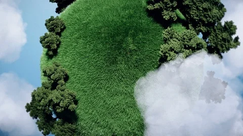 Seamless looping small planet with grass and trees in blue sky and clouds. Stock Footage 120020157