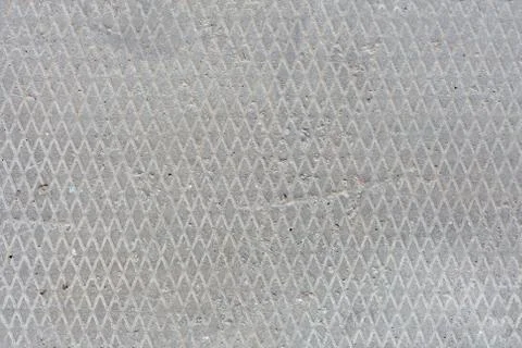 Seamless old flat concrete texture with diamond pattern and signs of light Stock Photos