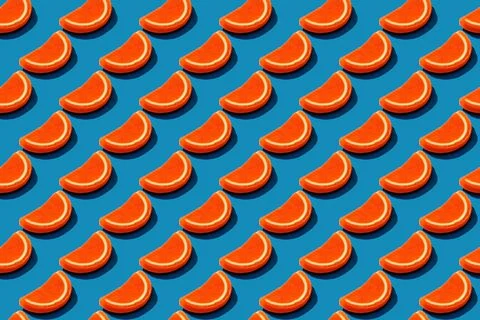 Seamless orange drops pattern on blue background Stock Photos