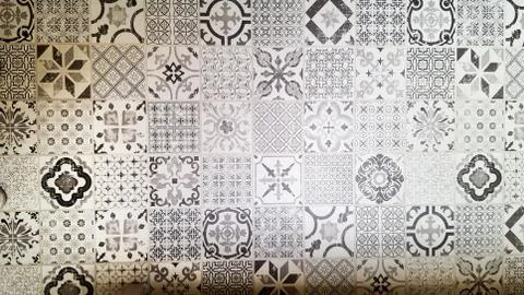 Seamless patchwork pattern from dark grey and white Moroccan tiles Stock Photos