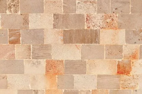 Seamless pattern of aged castle wall stone texture in the Greek city of Lindos Stock Photos