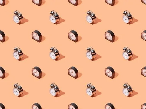 Seamless pattern alarm clocks peach Stock Photos
