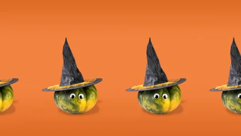 Seamless pattern animation with many pumpkins, googly eyes and witch hats Stock Footage 140934771