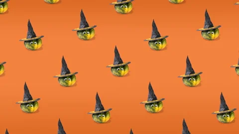 Seamless pattern animation of many pumpkins with googly eyes and witch hats Stock Footage 140942496