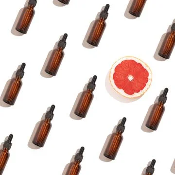 Seamless pattern of anti aging serum in glass bottle with dropper Stock Photos