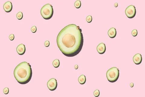 Seamless pattern avocado on light pink background Stock Photos