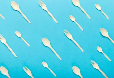Seamless pattern of bioplastic single use cutlery isolated on blue Stock Photos