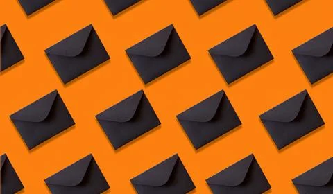 Seamless pattern black envelopes on orange background Stock-Fotos