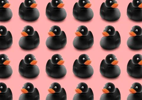 Seamless pattern of black rubber ducks in isolated pink pastel background Stock Photos