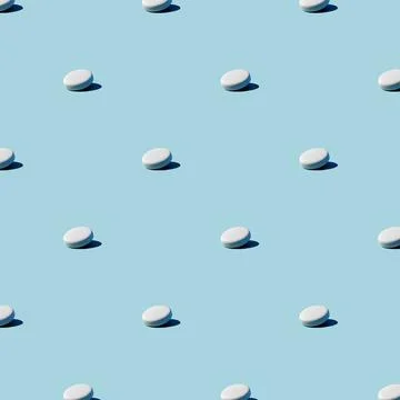 Seamless pattern with blue and white capsules, pills. Medical pharmacy flat l Stock Illustration