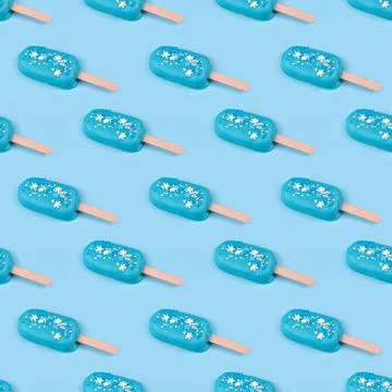 Seamless pattern blue mint ice cream popsicles on blue background. Tasty and  Stock Photos