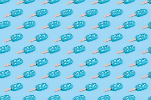 Seamless pattern blue mint ice cream popsicles on blue background. Tasty and  Stock Photos