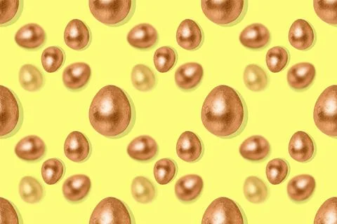 Seamless pattern with bronze eggs on a yellow background. Stock Illustration