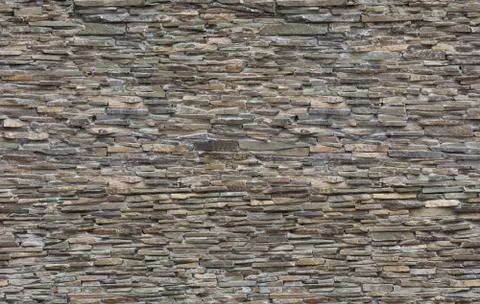 Seamless pattern of brown brick stone wall Stock Photos
