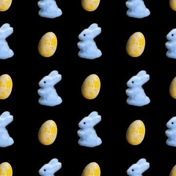 Seamless pattern of bunnies and eggs isolated on a black background Stock Illustration