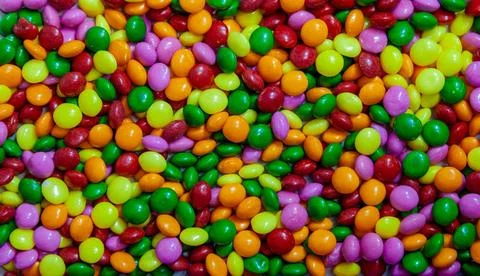 Seamless pattern with candy. Colorful candy background. Many sweet candies... Stock Photos