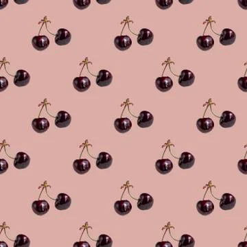 Seamless pattern with cherries on a twig on a pink background. Minimal isomet Foto stock