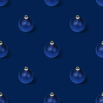 Seamless pattern with Christmas balls on a blue background.  Stock Photos