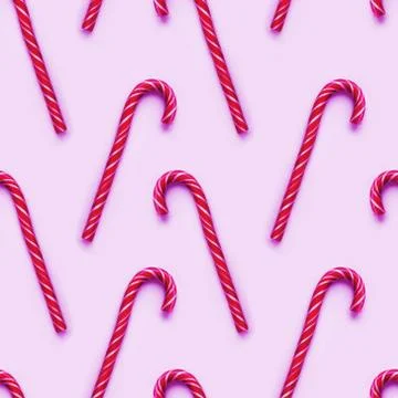 Seamless pattern of Christmas candy cone on magenta background. Colorful holi Stock Photos