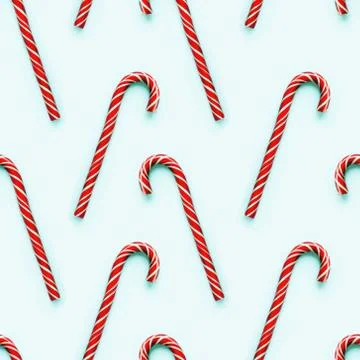 Seamless pattern of Christmas candy cone on light cyan background. Colorful h Foto stock