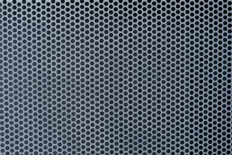 Seamless pattern of circular black holes in a silver metallic grid Stock Photos