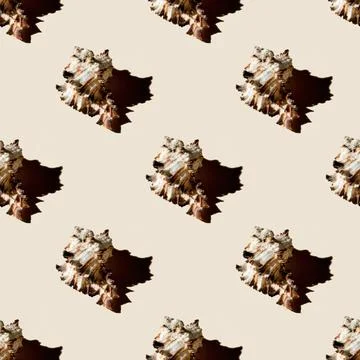 Seamless pattern of clam shells on a pastel yellow background. Stock Photos