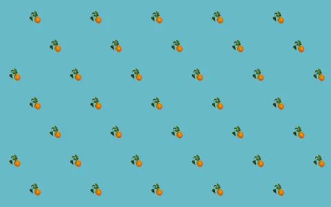 Seamless pattern with clementines and green leaves on blue background. Stock Photos