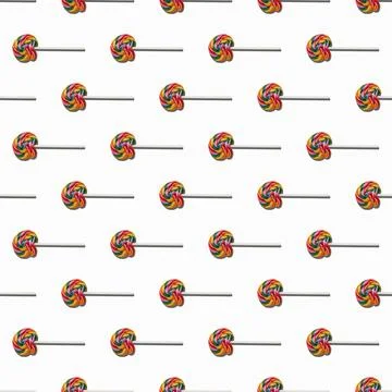Seamless pattern of colorful lollipops on a white background. Candy concept to Stock Photos