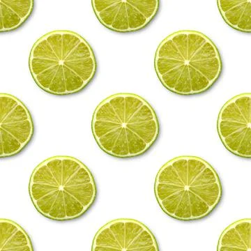 Seamless pattern with cut limes on a white background, top view. fruity backd Stock Photos