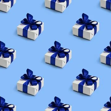 Seamless pattern with cute gifts on blue background. Christmas decorations. Stock Photos