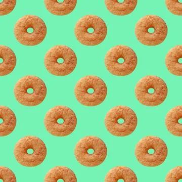Seamless Pattern of Delectable Cinnamon Doughnut on Mint Green Stock Photos