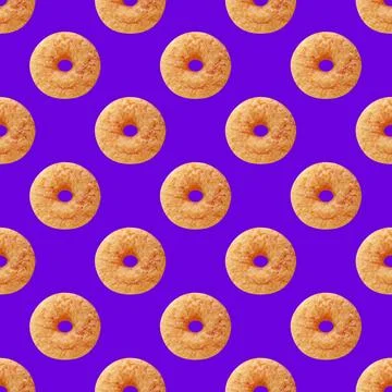 Seamless Pattern of Delectable Cinnamon Doughnut on Blue Background Stock Photos