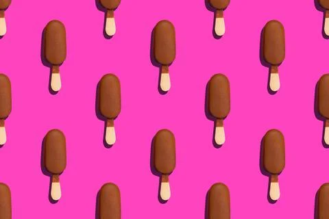 Seamless pattern of a delicious chocolade glazed eskimo on a pink background Stock Photos