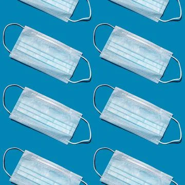 Seamless pattern of disposable face masks. Stock Photos