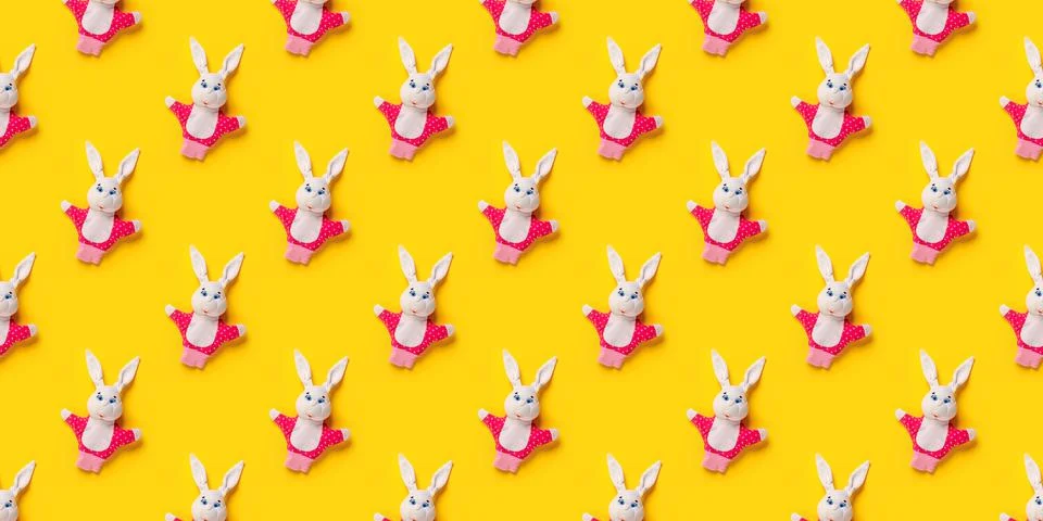 Seamless pattern. Easter bunnies isolated on yellow background. Funny texture 스톡 사진