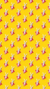 Seamless pattern. Easter bunnies isolated on yellow background. Funny texture Stock Photos