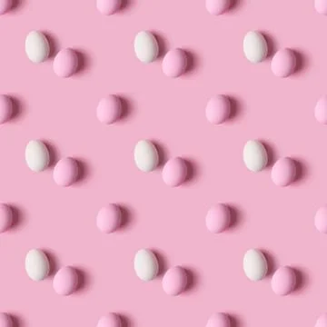 Seamless pattern of Easter eggs over pink background, top view 스톡 사진