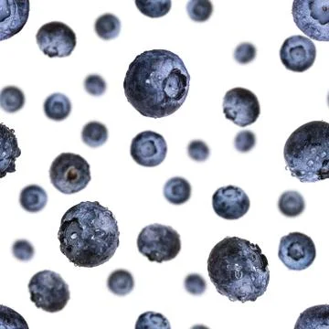 Seamless pattern with falling fresh blueberries isolated on white Stock Photos